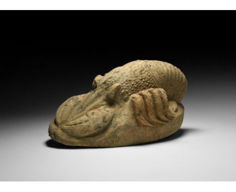 1st-3rd century AD. A high-relief ceramic lobster figure on an integral ellipsoidal base, with lower end of tail curled benea