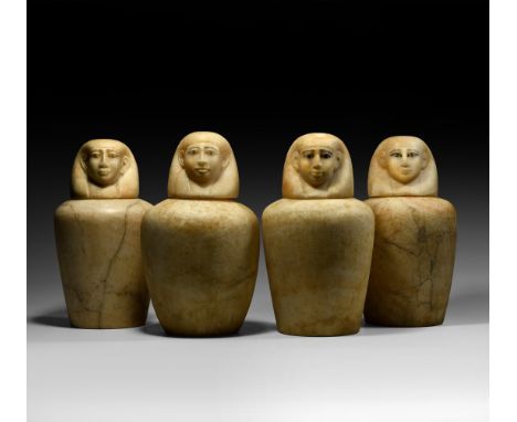 12th-18th Dynasty, 2134-1292 BC. A set of four alabaster canopic jars with human-headed stoppers, each individually modelled 