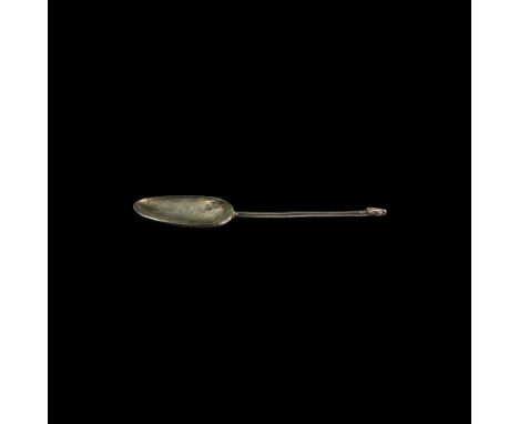 2nd-1st century BC. A silver spoon with shallow ellipsoidal bowl and square-section handle with dog-head finial.19.8 grams, 1