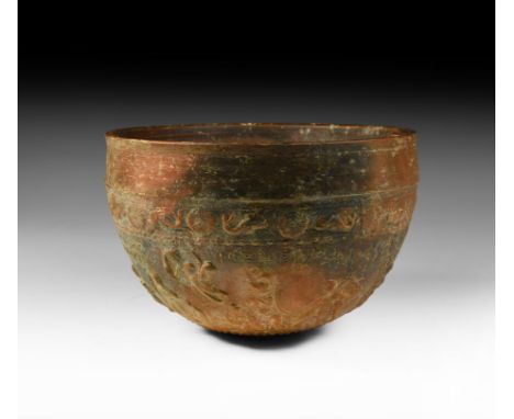 1st century BC-1st century AD. A large Samian ware beaker in light brown clay with moulded relief decoration in the Barbotine