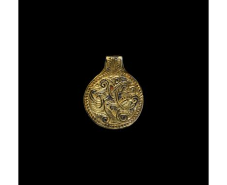 7th century AD. A gilt-silver disc-shaped pendant with a stylised beast formed from interlaced lines within a dashed ropework