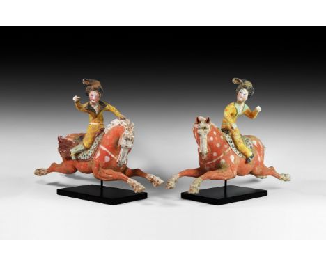 Tang Dynasty, 618-907 AD. A dynamic pair of ceramic polo players, each modelled in the round and depicting a female polo play