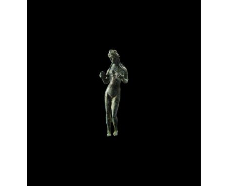 2nd-3rd century AD. A bronze statuette in a pose typically adopted by the goddess Venus, modelled in the round, standing nude