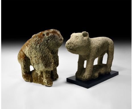 11th-12th century AD. A 'pair' of large carved stone animal figures comprising: a lion standing on a rectangular D-section ba