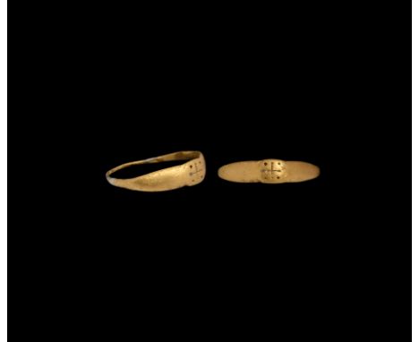 12th-13th century AD. A gold finger ring with slender tapering D-section hoop, expanded shoulders and oval-shaped bezel featu