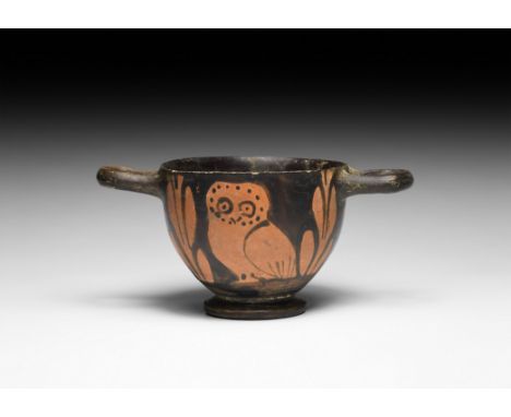 5th-4th century BC. A ceramic skyphos with sphero-conical body, two D-section handles and broad foot; a standing owl amid lea