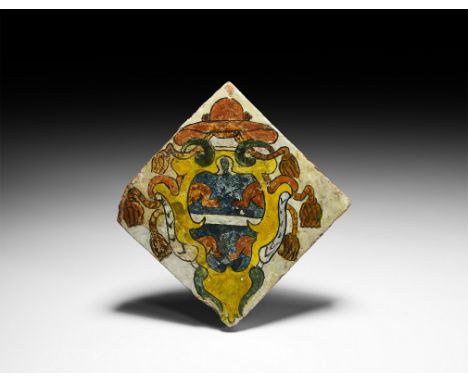 Dated 1502 AD. A rectangular ceramic maiolica armorial floor tile, depicting the arms of a cardinal(?) on a white field compr