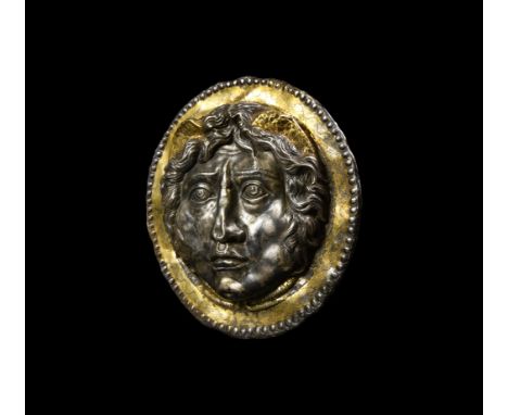 1st-2nd century AD. A substantial ornamental silver armour phalera with gilt detailing, embossed face of Gorgon Medusa to the