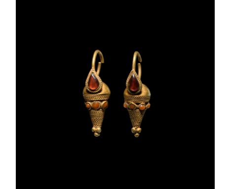 2nd-1st century BC. A pair of gold earrings, each with penannular hoop above conical pendant with pyramid granulation finial,