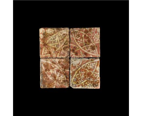 14th century AD. A group of four ceramic floor tiles with white vesica and grapevine motif, English workmanship.1.5 kg total,