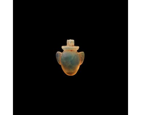New Kingdom, 1550-1070 BC. A substantial translucent chalcedony heart, ib, amulet with ribbed suspension loop above.Cf. Andre