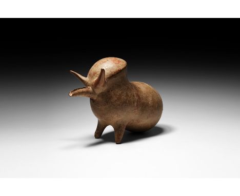 12th-9th century BC. A ceramic vessel in the form of a standing bull, with a bulbous body and discoid rump with slender tail;