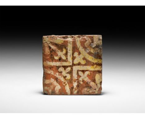 14th-15th century AD. A rectangular ceramic tile with white geometric fleur-de-lys motif to two quadrants, an arc with smalle