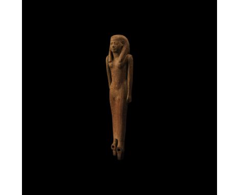 New Kingdom, 1550-1070 BC. A carved wooden figure modelled as a standing female wearing a wig and ankle-length garment; arms 
