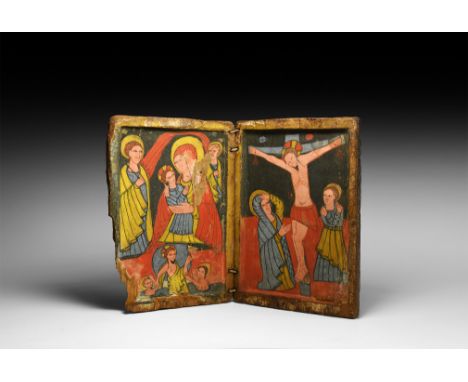 16th century AD. A portable wooden diptych icon depicting the Crucifixion with the Virgin and Saint John; the Nativity with V