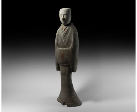 Han Dynasty, 206 BC-220 AD. A substantial ceramic attendant figure modelled standing with hands held within voluminous sleeve