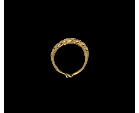 10th-12th century AD. A twisted gold finger ring with tapering shank formed as two twisted rods.Cf. Johnson, C.E., A Typologi