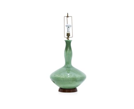 A GREEN-GLAZED CERAMIC TABLE LAMP
Bottle shape with streaked green glaze
52cm high
Condition: For a condition report or furth