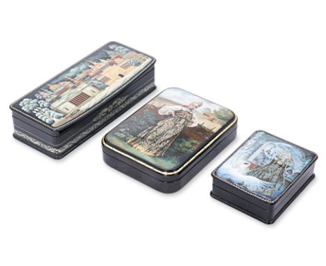 A GROUP OF THREE RUSSIAN LACQUER BOXES
Late 20th Century, one with depicting a city within a winter landscape, signed lower r