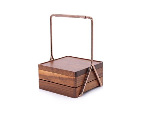 A TANG TANG TANG COPPER AND WOOD TIERED CADDY
The copper finish support and handle with a two tiered detachable tray, with co