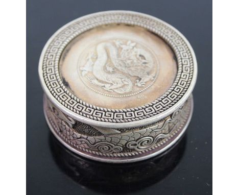 A white metal Zodiac snuff box, dia. 5cm