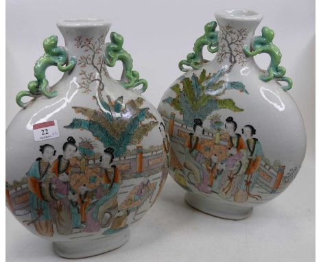 A pair of Chinese porcelain moon flasks, each enamel decorated with figures, height 34cmBoth appear in good conditon, free fr