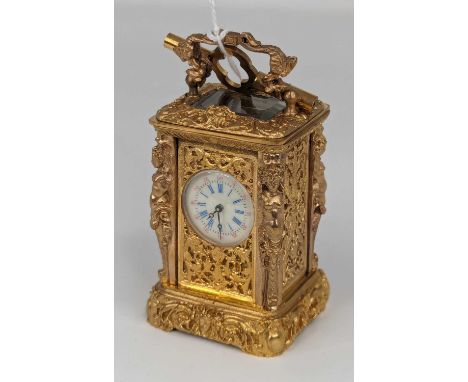 A modern gilt metal cased minuet carriage timepiece, having an enamelled dial with Roman numerals and Arabic outer scale, fla