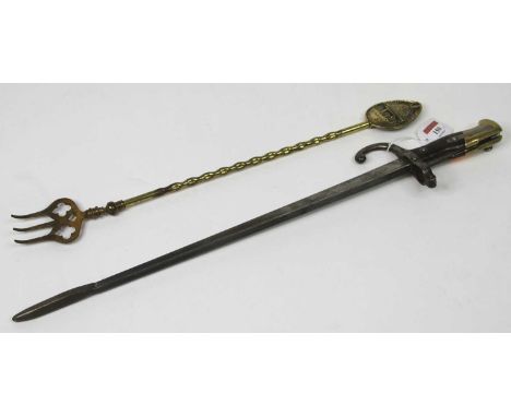 A bayonet converted to a fire poker, together with a brass toasting fork