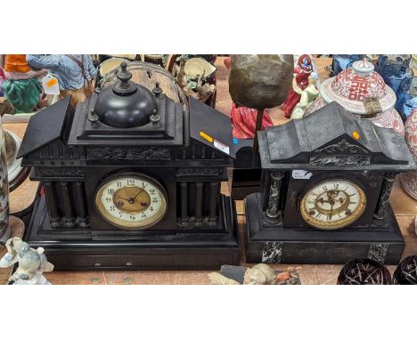 A Victorian black slate mantel clock, of architectural form, the enamel chapter ring showing Arabic numerals, having an eight