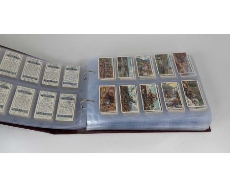 An album containing 18 full sets of cigarette cards, to include Wills and MitchellsSETS INCLUDE: Mitchell's Famous Crosses; P