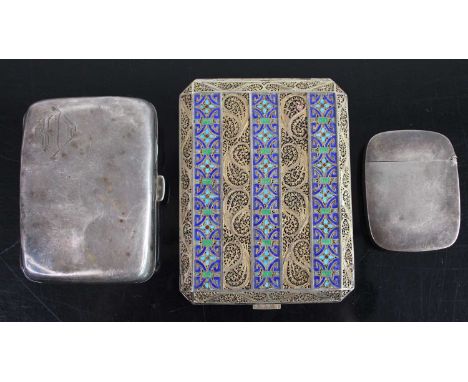 A silver pocket cigarette case; together with a silver plated vesta case; and a gilt metal and filigree enamel decorated pock