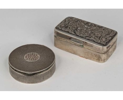 A white metal pill box of hinged rectangular form, the cover repoussee decorated with a figure of Ganesh? stamped verso 925 S