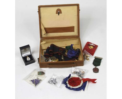A collection of mixed enamel badges and medals