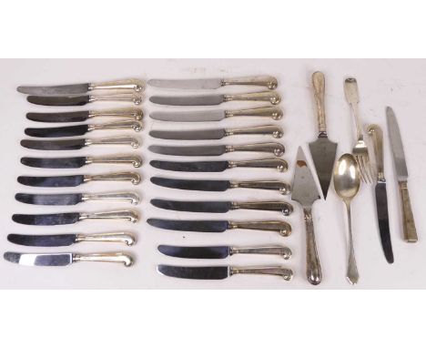 A collection of silver and silver handled flatware, to include a set of 22 pistol-grip knives 