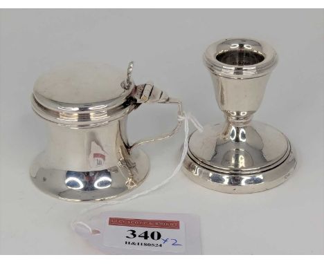 An early 20th century silver mustard, of waisted cylindrical form, with raised cast shell thumbpiece (lacking liner); togethe