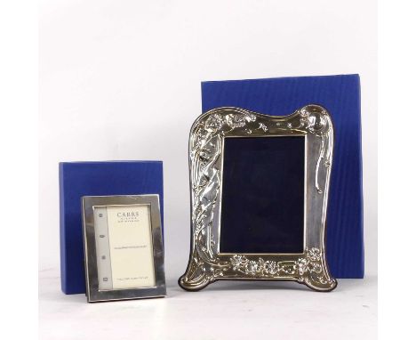 A Carr's of Sheffield silver-clad Art Nouveau style easel photograph frame, stamped 925, sight 13 x 9cm; together with anothe
