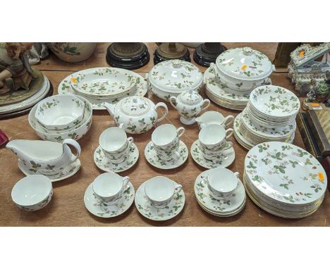 A Wedgwood Wild Strawberry pattern tea &amp; dinner service9 teacups, 6 saucers, 12 tea plates, 7 bowls, one teapot, one milk