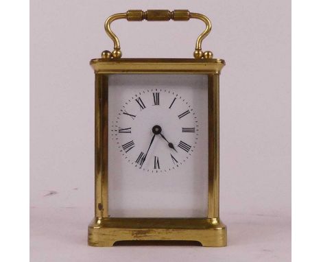 A lacquered brass carriage clock, the enamelled dial showing Roman numerals, having visible platform escapement, h.12cm 