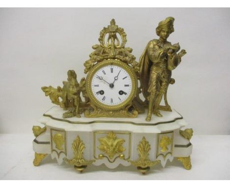 A late 19th century French gilt metal and marble mantle clock, decorated with a gilt figure and a dog amongst a floral design