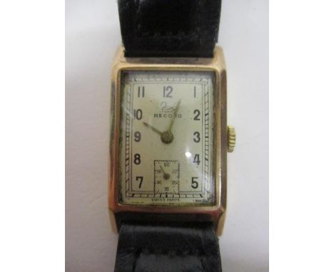 A Record gents manual wind 9ct gold 1930s wristwatch. The dial having Arabic numerals and subsidiary seconds dial. The 15 jew