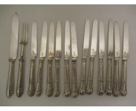 A set of twelve George III silver, shell pattern table knives by S P London 1816 and one blade by Moses William &amp; Sydenha