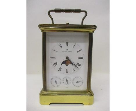 A Matthew Norman brass repeating alarm carriage clock.  The white enamel dial having Roman numerals enclosing a moon-phase di