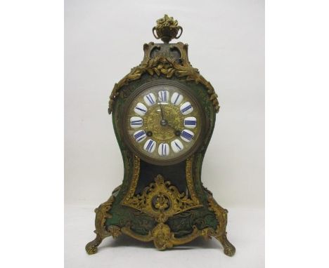 A late 19th century French green boulle mantle clock. The gilt dial having Roman numerals, the case having gilt mounts with f