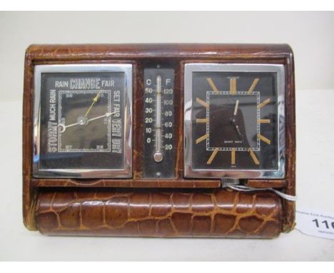 An Art Deco Le Coultre travelling combination timepiece comprising a clock, a barometer and a thermometer in a leather fold o