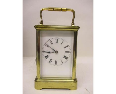 An early 20th century French brass mantel clock having a white enamel dial with Roman numerals and blued handles, 7 1/4"h x 3