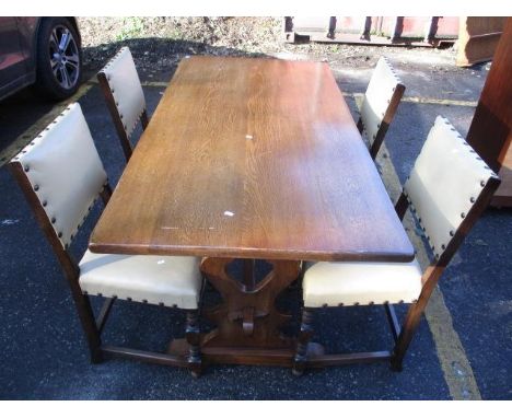 An oak refectory dining table 30 3/4"h x 60"w, and a set of four leather button back chairs 