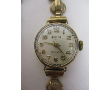 An Accurist ladies manual wind 9ct gold 1960s wristwatch. The 21 jewel movement housed in a 9ct gold case and bracelet, 11.2 