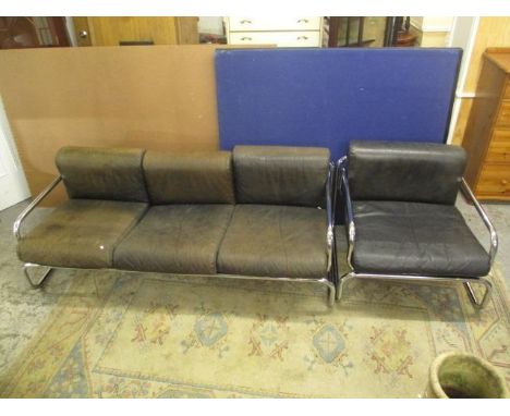 A 1970s Terence Conran Habitat tubular chrome framed, three seater settee and matching armchair with black leather cushions s