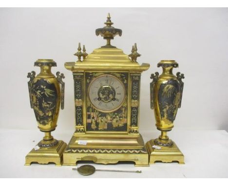 A 19th century French, gilt metal mantle clock and garniture set. The clock in the form of a Chinese temple decorated with ch