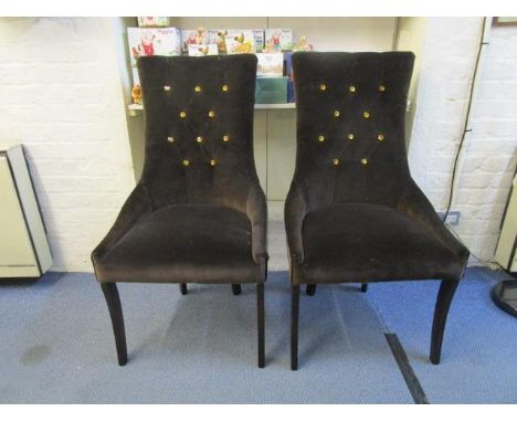 Two contemporary lounge side chairs, button back upholstery in a dark brown fabric, with amber faceted glass buttons, on in-c